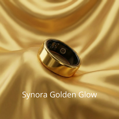 Synora Golden Glow smart ring resting on gold silk fabric. Premium luxury health tracker combining fashion and technology