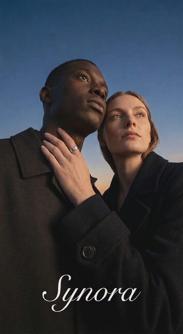 Couple wearing matching Synora smart rings at sunset. Unisex wearable technology for tracking sleep and wellness together.